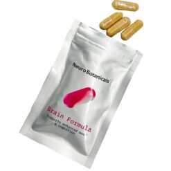 Close up of uniform clear vegetable capsules filled with a finely ground Brain Formula blend botanical powder